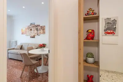 a living room with a table and a couch at Luxury and Sweet home-Metro Malatesta in Rome