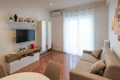a living room with a couch and a tv at Luxury and Sweet home-Metro Malatesta in Rome