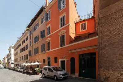 a small car parked in front of a building at 2 BR Flat with Vatican Terrace in Rome