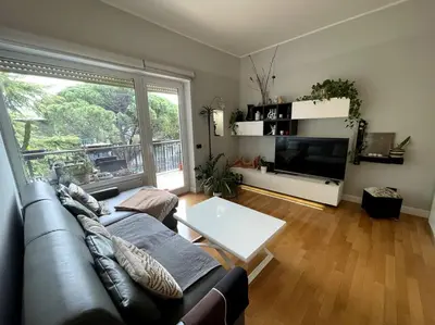 a living room with a couch and a large window at VaticanoDreamSuite in Rome