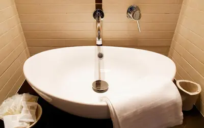 a white sink with a faucet in a bathroom at Residenza Cernaia in Rome