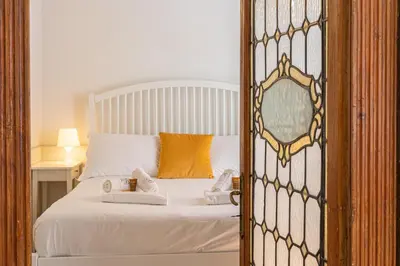 a bedroom with a bed with a mirror at Frattina Atmosphere by Rental in Rome in Rome