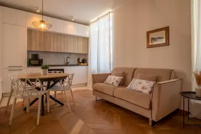 a living room with a couch and a table at Suite dei Re di Roma in Rome