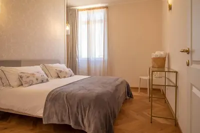 a bedroom with a bed and a window at Suite dei Re di Roma in Rome
