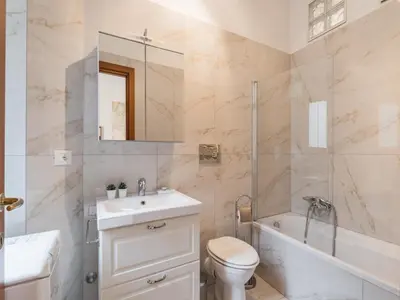 a bathroom with a sink and a toilet and a shower at The Best Rent – Bright two-bedrooms apartment in Testaccio area in Rome