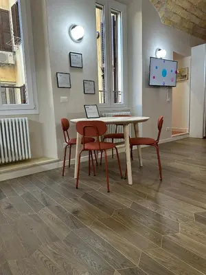 a dining room with a table and chairs at Santamaura Vatican Apartment in Rome