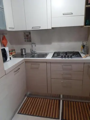a small kitchen with a sink and a stove at La casa di Gloria in Rome