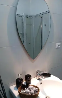 a bathroom sink with a mirror and a basket on it at Belle Arti home in Rome