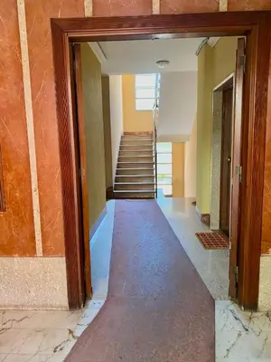 an empty hallway with stairs in a building at Domus Carola in Rome