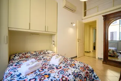 a bedroom with a bed with towels on it at Quattro Cantoni Apartment Monti in Rome