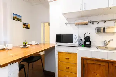 a kitchen with a counter top with a microwave at Central near Piazza Navona by NDP rent in Rome