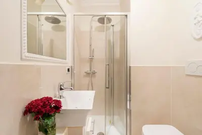 a bathroom with a shower and a sink and a toilet at Luxury Blu Rome in Rome