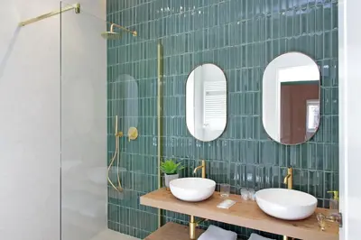 a bathroom with two sinks and two mirrors at YCH-Casa Bella- Luxury home near Piazza Venezia in Rome
