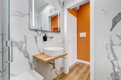 a bathroom with a sink and a mirror at LISA SUITE in Rome