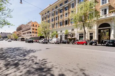 a city street with cars parked on the side of the road at LISA SUITE in Rome