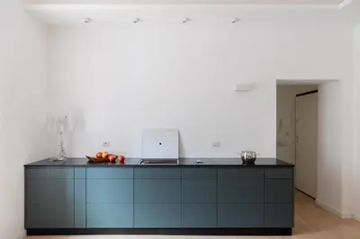 a kitchen with a counter with a laptop on it at iFlat Vatican 2 Bedroom Design Apartment in Rome