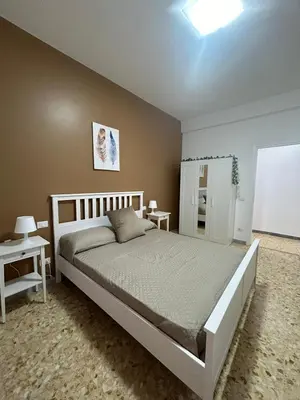 a bedroom with a large bed in a room at A & F Apartment in Rome