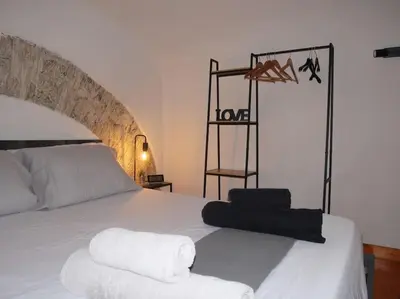 a shelf with a love sign on it in a room at Metro Roma Termini - Love in Loft in Rome
