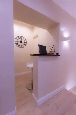 a room with a counter with a laptop on a wall at Villa Borghese Prestige Rooms in Rome