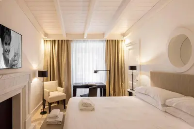 a hotel room with a bed and a desk at Viam Villa Futura in Rome