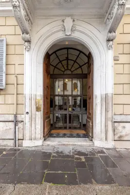 an entrance to a building with an archway at Luxury apartment in the Heart of Rome - near metro A and B in Rome