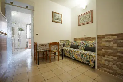 a living room with a couch and a table at Dimora San Giovanni in Rome