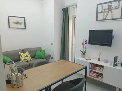 a living room with a couch and a table at Domus Fanti in Rome