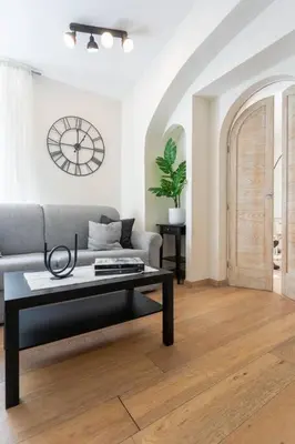 a living room with a couch and a coffee table at MyRentalInn - Rome - Trastevere Arch Suite in Rome