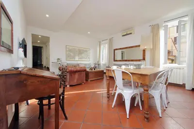 a kitchen and dining room with a table and chairs at Pantheon 2 Bedrooms in Rome