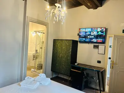 a bathroom with a sink and a shower and a mirror at Cenci Guest House in Rome