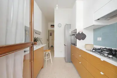 a kitchen with a sink and a stove at YCH-Appartamento Luminoso a San Pietro in Rome