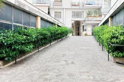 an empty corridor in a building with plants at YCH-Appartamento Luminoso a San Pietro in Rome