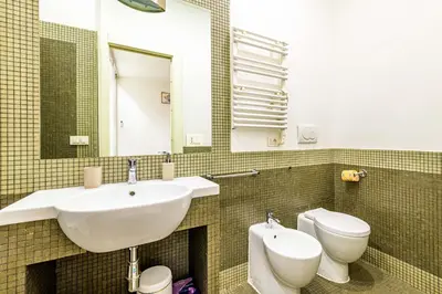 a bedroom with a large bed in a room at Deluxe Apartments Pantheon in Rome