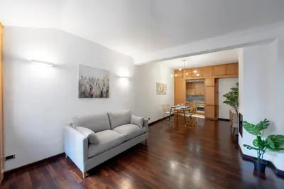 a living room with a couch and a table at Elizabeth's Place Spanish Steps in Rome