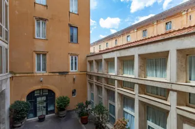 a row of buildings with plants in a courtyard at Elizabeth's Place Spanish Steps in Rome
