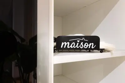 a black bag sitting on a shelf with the word malcolm at Cozy Vatican in Rome