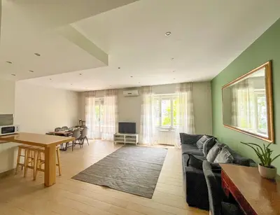 a living room with a couch and a table at Vatican Family House 2 Baths & 3 Rooms in Rome