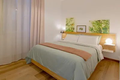 a bedroom with a large bed in a room at Casa Coppedè in Rome