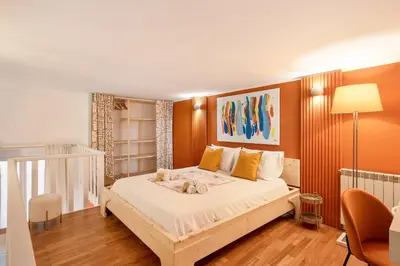a bedroom with a large bed in a room at Piazza Navona Suite - Pantheon in Rome