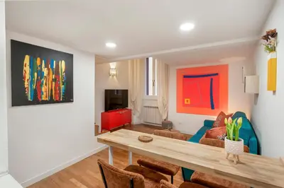 a living room with a table and a couch at Piazza Navona Suite - Pantheon in Rome