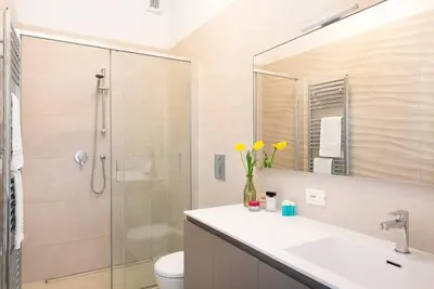 a bathroom with a shower and a sink and a toilet at Idyllia - Bright and modern apt in Rome