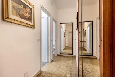 a hallway with two mirrors on the wall at La Casa di Umberto in Rome