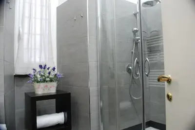 a bathroom with a shower with a glass door at Costantino Primo Holiday - Roma St.Pietro in Rome