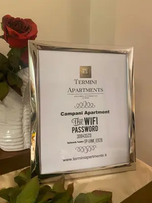 a framed picture of a framed award for a program at Campani Luxury Suite in Rome