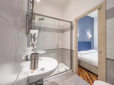 a bathroom with a sink and a shower at La Grande Bellezza Guest House Rome in Rome