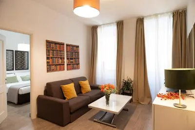 a living room with a couch and a table at Banchi Vecchi Stay Apt Suite Navona in Rome