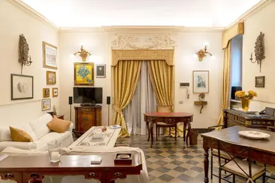 a living room with a couch and a table at Colosseum Charming Loft - Santa Maria in Carinis in Rome