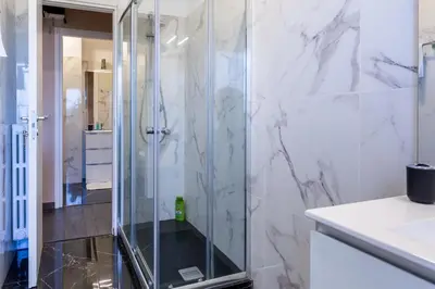 a shower with a glass door in a bathroom at Cipro Vatican House in Rome