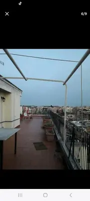 a balcony with a view of a city at Stanza in superattico, terrazzato, luminoso, accogliente, bagno privato in Rome