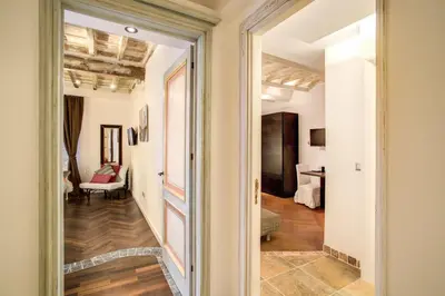 a hallway with a door leading to a living room at Orso Luxury Apartment in Rome